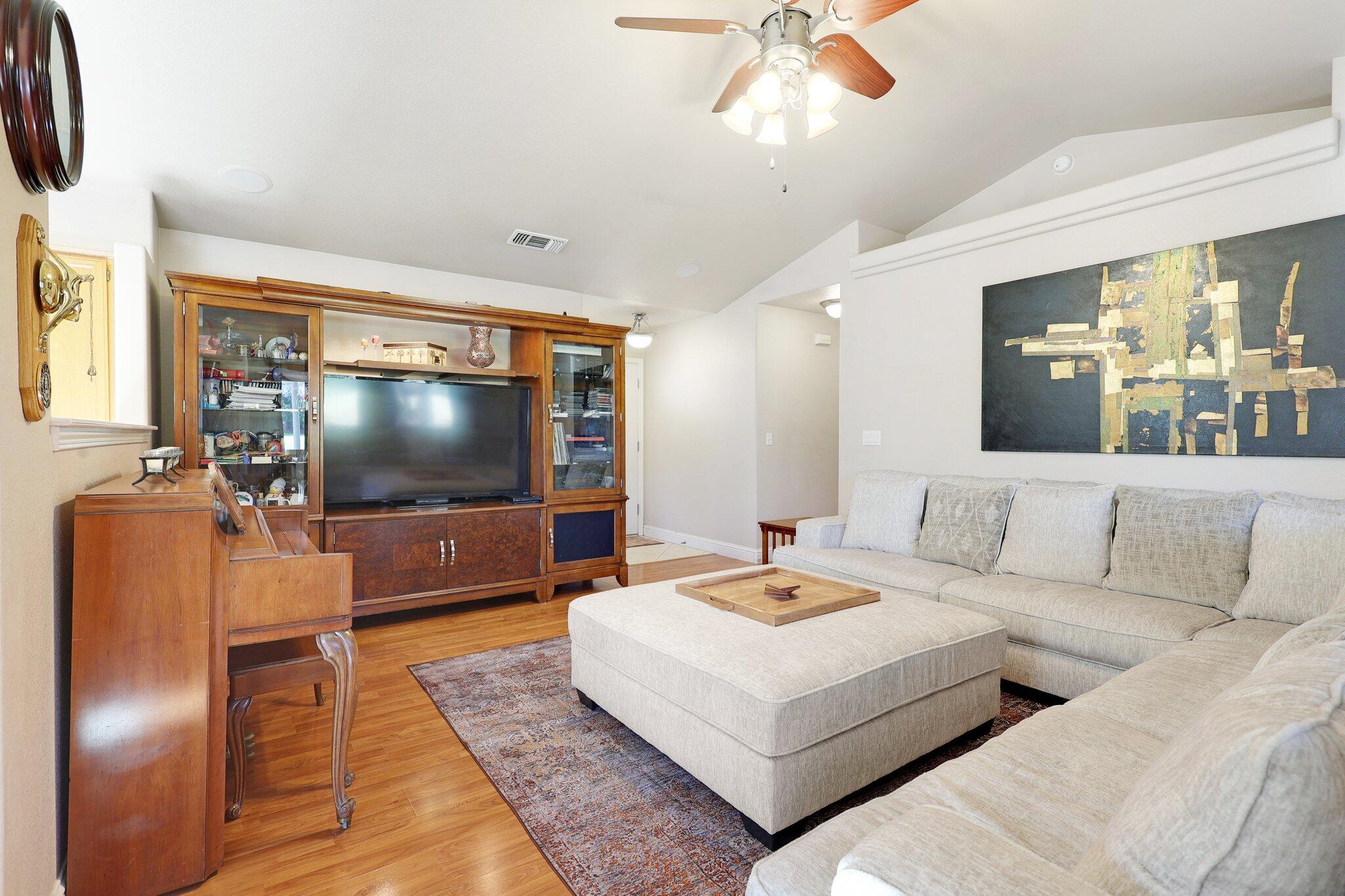 3375 Lawrence Road Redding, CA 96002 - Photo 9 of 46 a living room with furniture and a flat screen tv