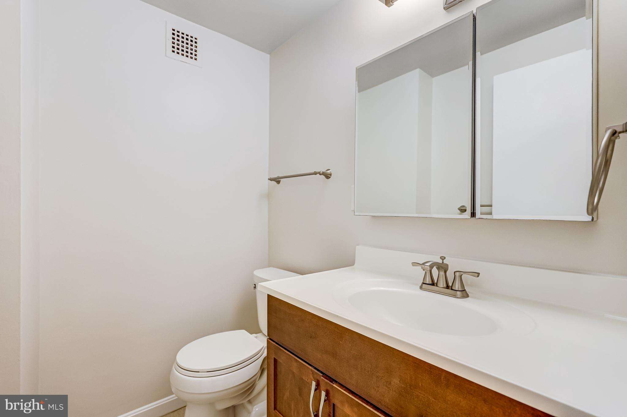 4141 North Henderson Road, Unit 303 Arlington, VA 22203 - Photo 11 of 37 Hallway Half Bath-Handy for Residents & Guests