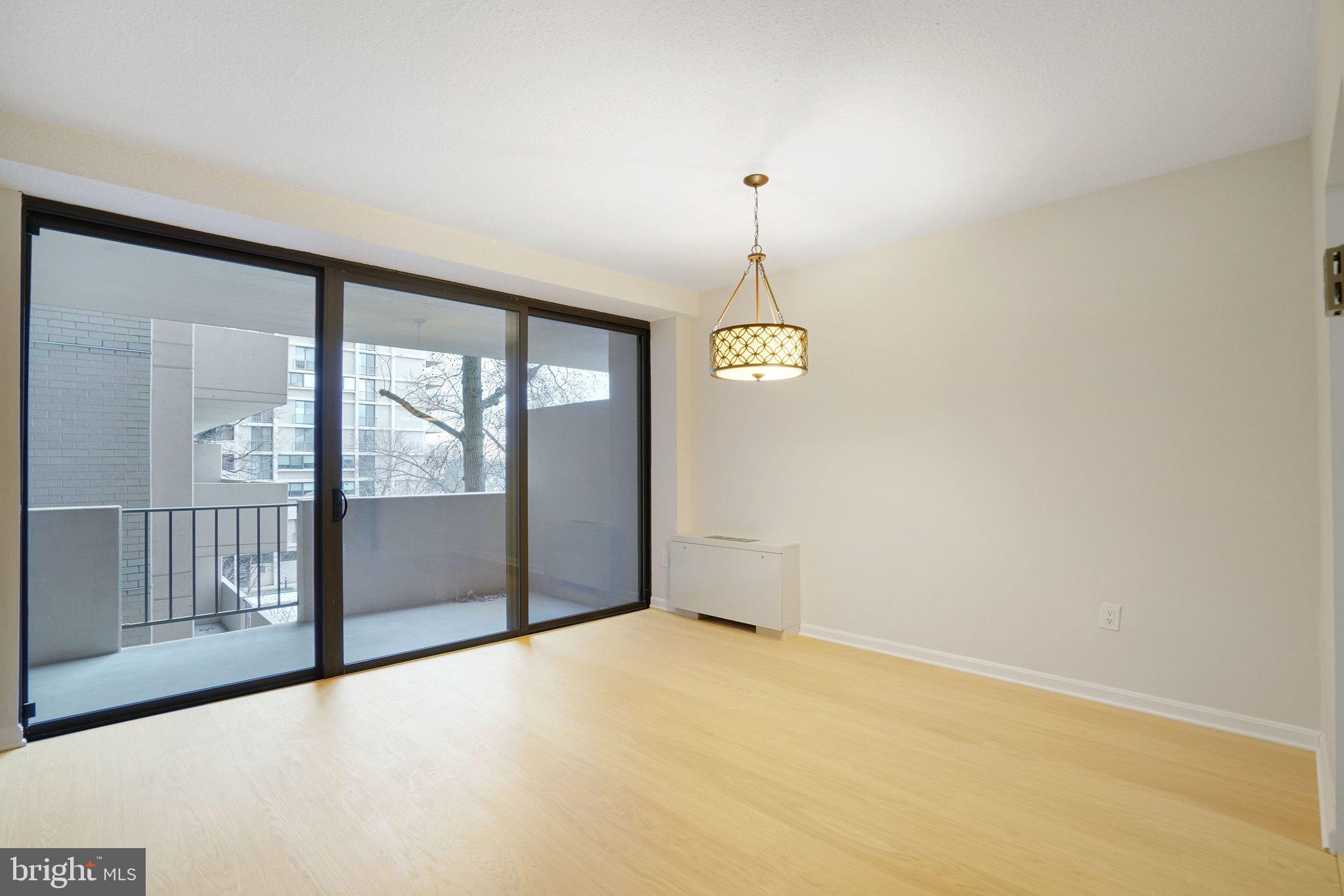 4141 North Henderson Road, Unit 303 Arlington, VA 22203 - Photo 18 of 37 a view of empty room with windows