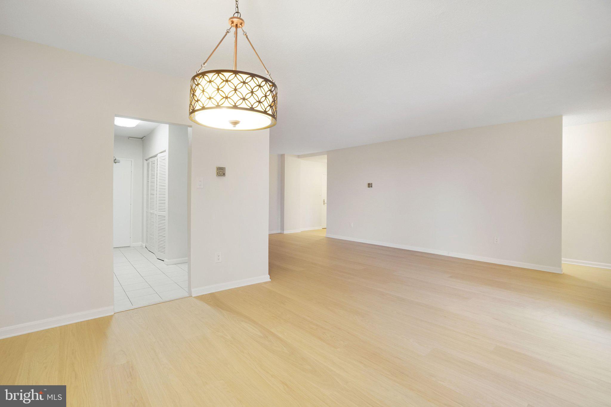 4141 North Henderson Road, Unit 303 Arlington, VA 22203 - Photo 19 of 37 a view of a hallway with a chandelier