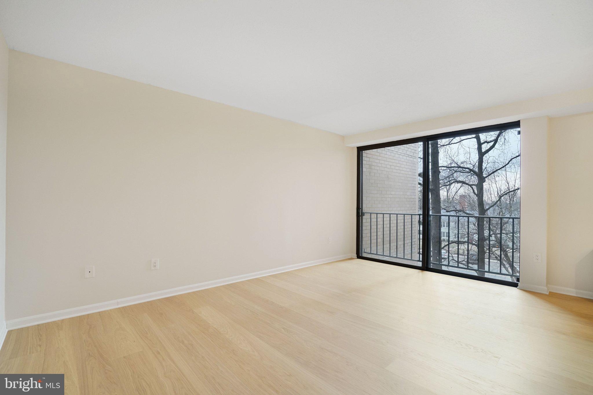 4141 North Henderson Road, Unit 303 Arlington, VA 22203 - Photo 21 of 37 wooden floor in an empty room with a window
