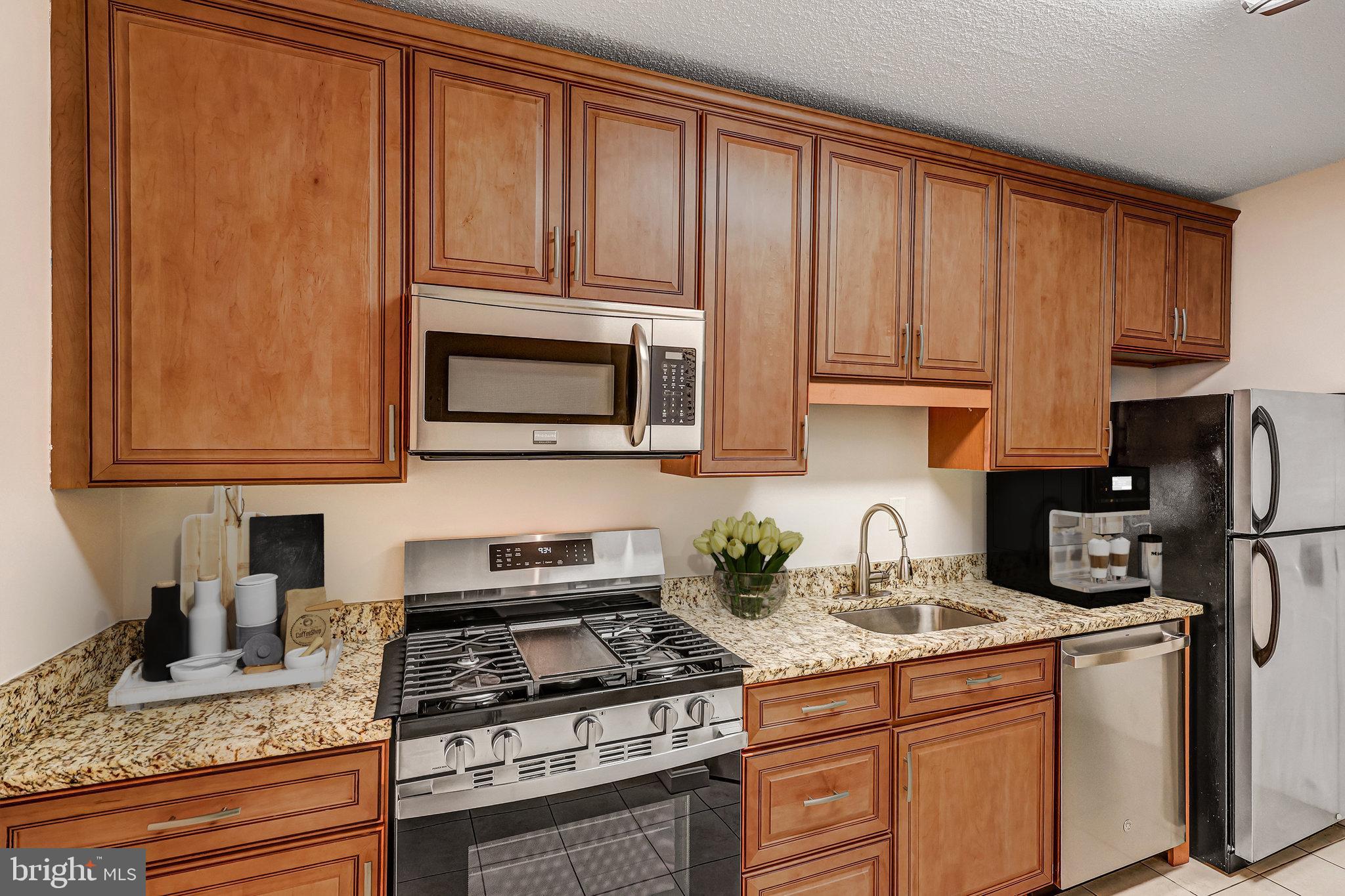 4141 North Henderson Road, Unit 303 Arlington, VA 22203 - Photo 8 of 37 Welcoming Kitchen
New Gas Stove
