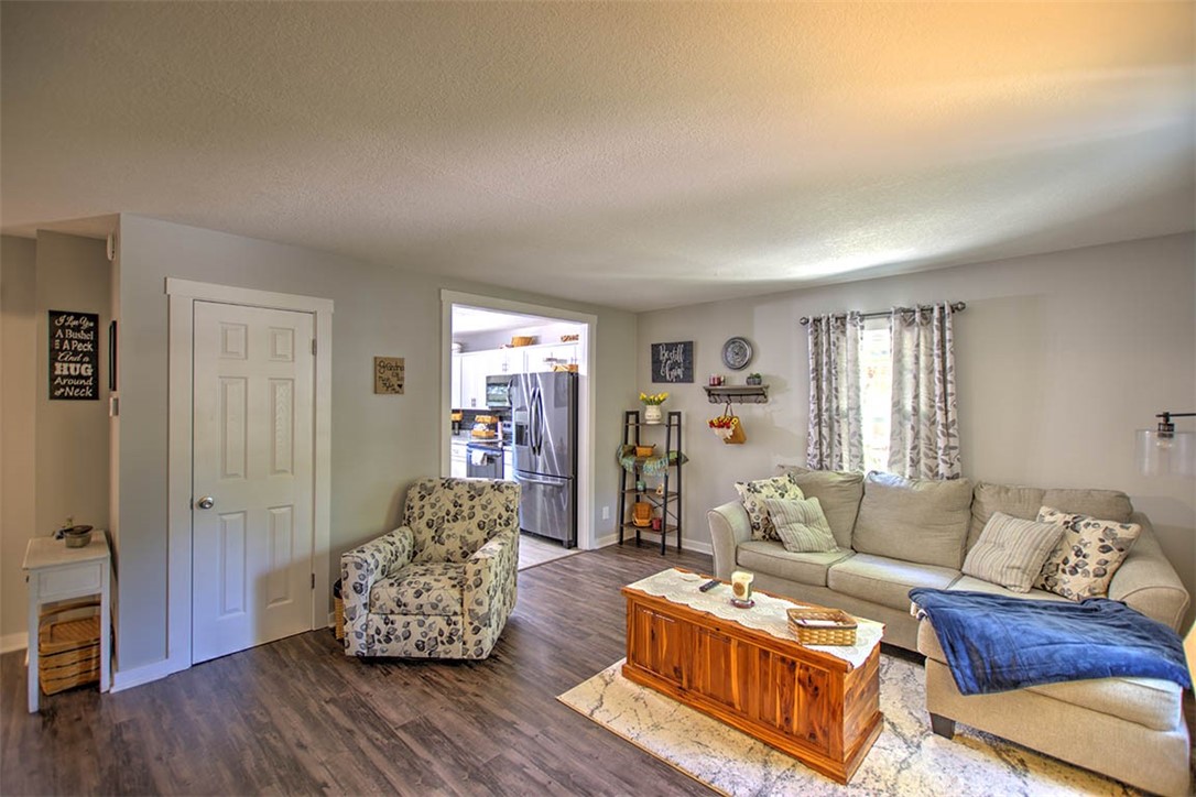 2925 East Main Street Decatur, IL 62521 - Photo 5 of 20 a living room with furniture and wooden floor