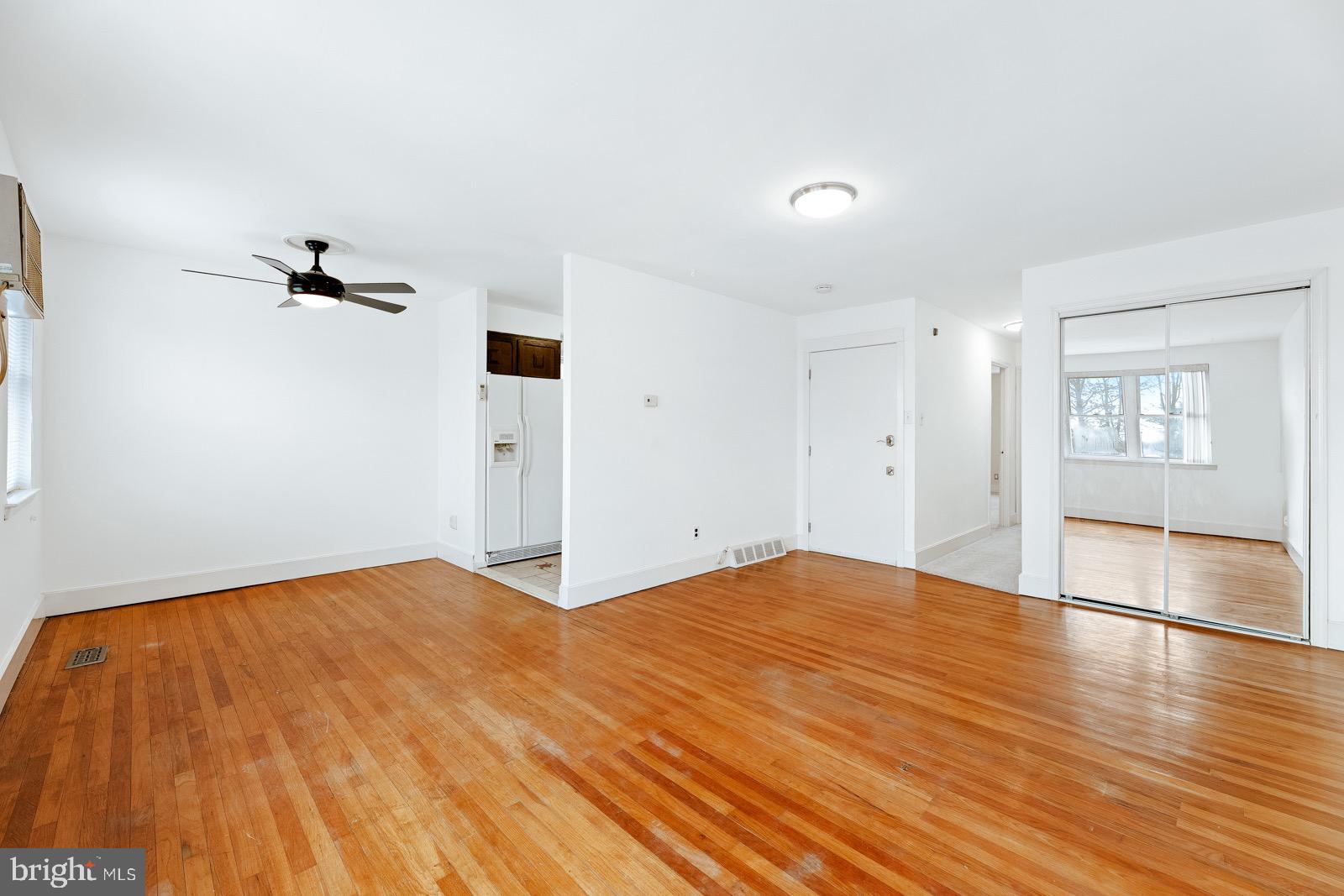 12450 Knights Road, Unit 2 Philadelphia, PA 19154 - Photo 25 of 43 a view of empty room with wooden floor and windows