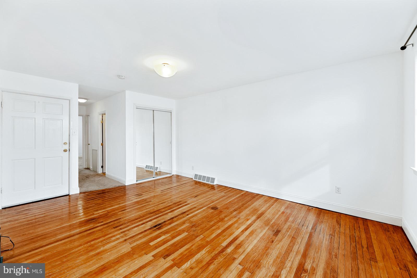 12450 Knights Road, Unit 2 Philadelphia, PA 19154 - Photo 8 of 43 a view of an empty room and wooden floor