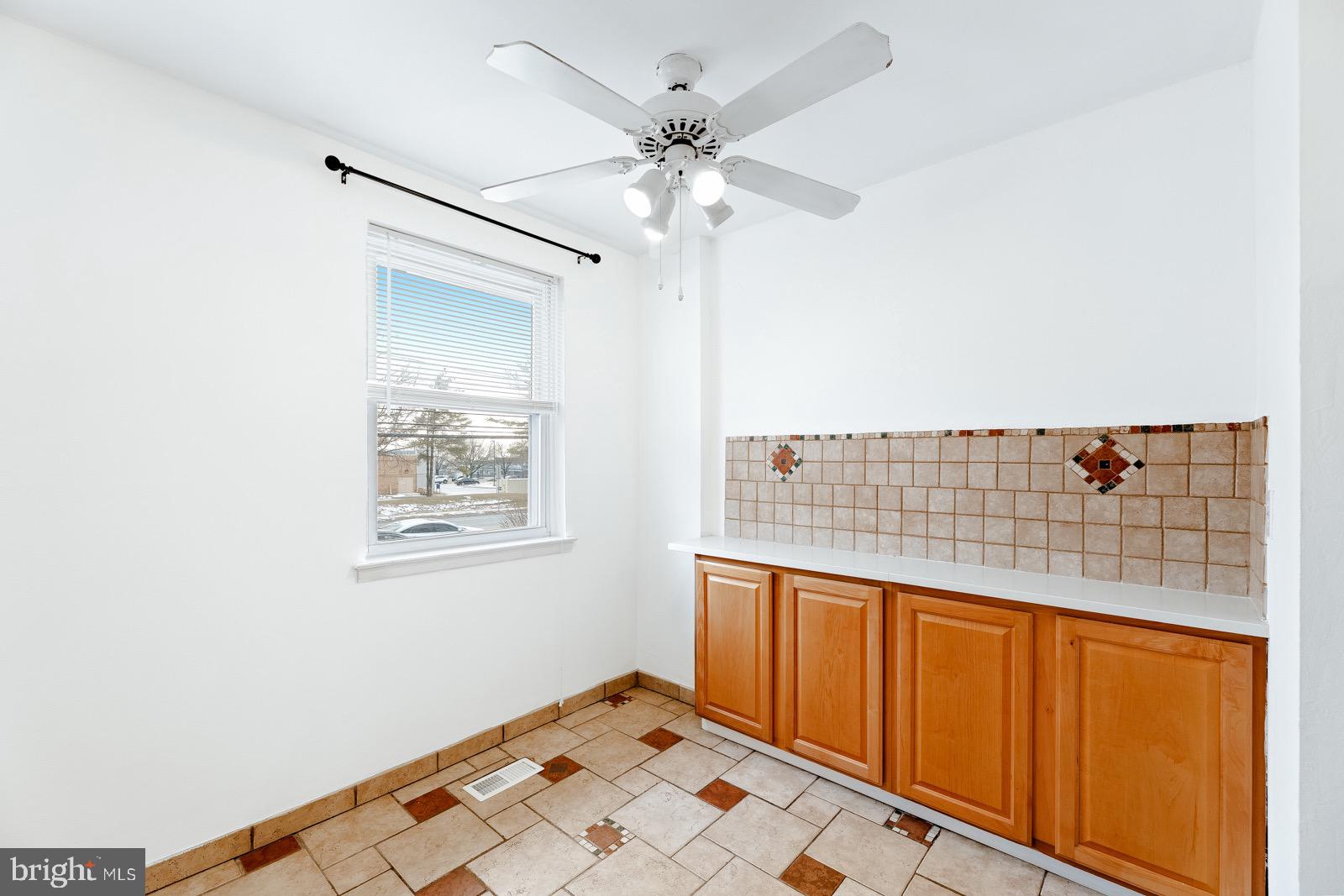 12450 Knights Road, Unit 2 Philadelphia, PA 19154 - Photo 10 of 43 a view of an empty room with a window