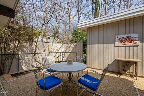 a bedroom with a bed and a mirror
