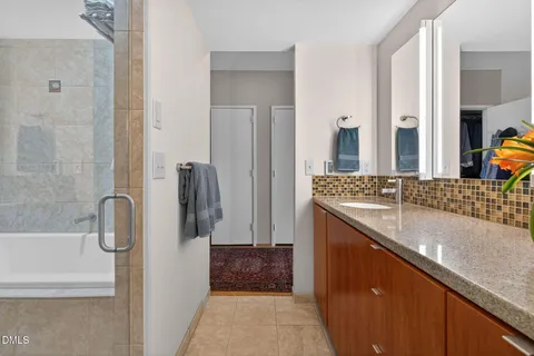 a bathroom with a sink a toilet and mirror