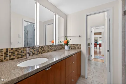 a view of backyard with tub and outdoor seating