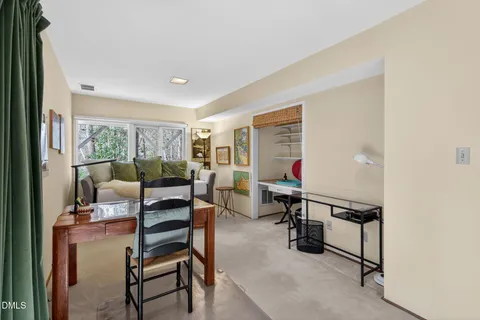 a view of a backyard with garden and patio