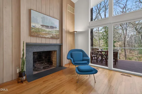 a living room with furniture a lamp and a fireplace