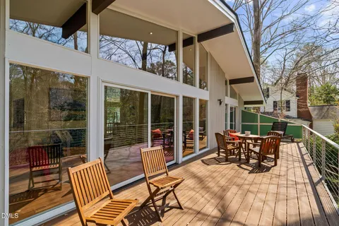 a view of a patio with a table and chairs
