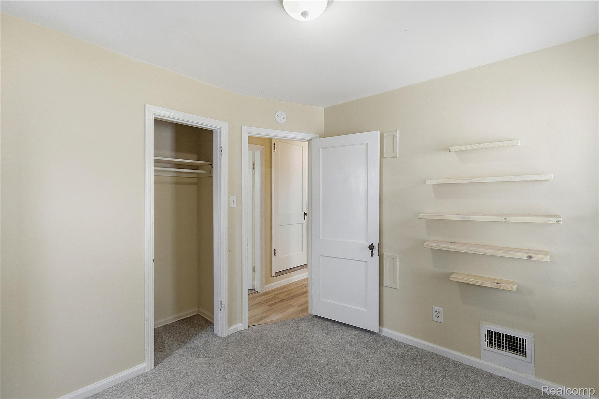 26104 Student Street Redford, MI 48239 - Photo 14 of 30 Unfurnished bedroom with light carpet and a closet