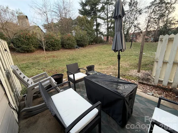 a view of a terrace with chairs and a table