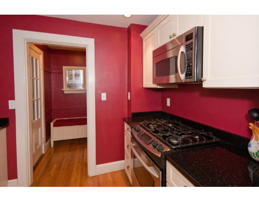 14 Robbins Road Lexington, MA 02421 - Photo 13 of 27 a kitchen with a stove a microwave and cabinets