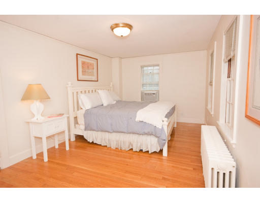 14 Robbins Road Lexington, MA 02421 - Photo 16 of 27 a bedroom with a bed and a chair