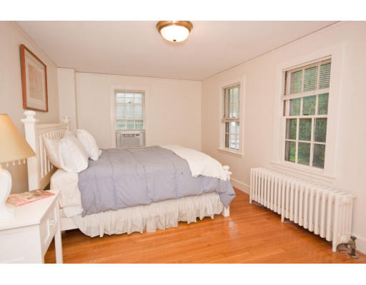14 Robbins Road Lexington, MA 02421 - Photo 17 of 27 a bedroom with a bed and a window