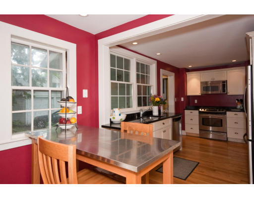 14 Robbins Road Lexington, MA 02421 - Photo 9 of 27 a living room with furniture a wooden floor and kitchen view