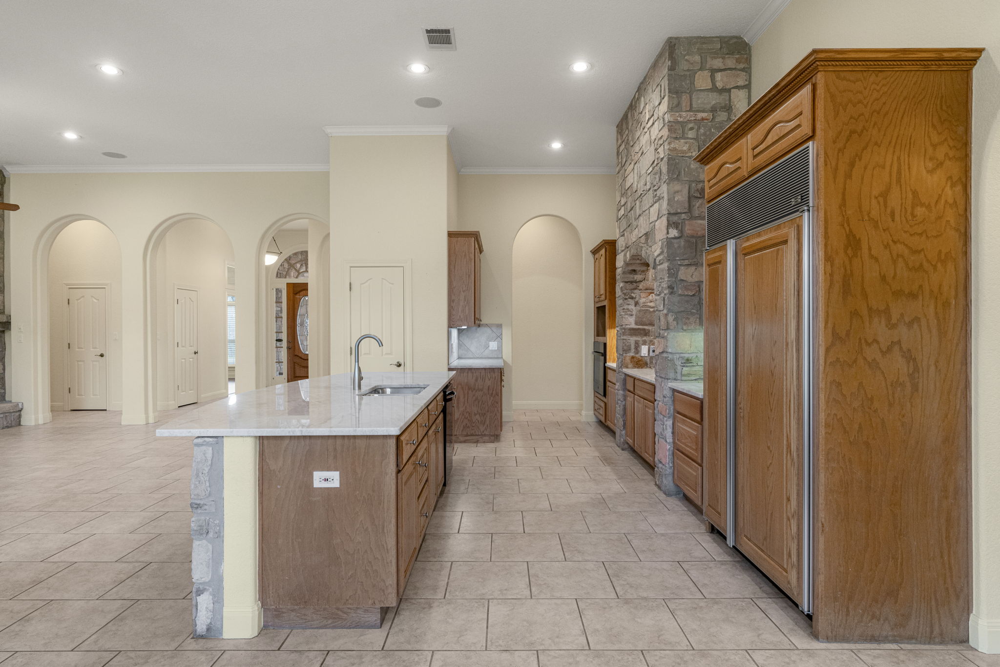 301 Goldridge Drive Georgetown, TX 78633 - Photo 10 of 40 a kitchen with stainless steel appliances granite countertop a sink and a refrigerator