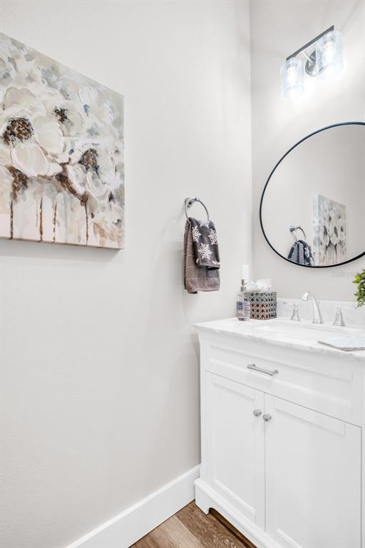 9840 West Bay Street Seminole, FL 33776 - Photo 24 of 75 a bathroom with a sink and a mirror
