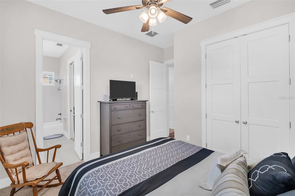 9840 West Bay Street Seminole, FL 33776 - Photo 35 of 75 a bedroom with a bed and furniture