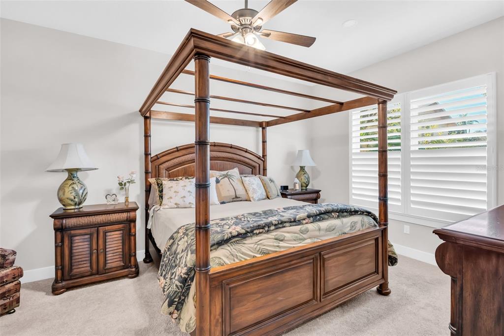 9840 West Bay Street Seminole, FL 33776 - Photo 37 of 75 a bedroom with a bed and a window