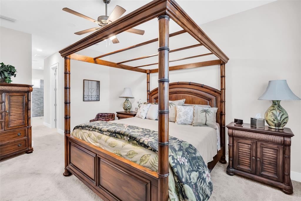 9840 West Bay Street Seminole, FL 33776 - Photo 38 of 75 a bedroom with a bed and a dresser