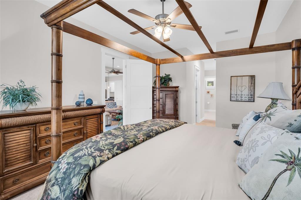 9840 West Bay Street Seminole, FL 33776 - Photo 39 of 75 a bedroom with a bed and a dresser next to a window