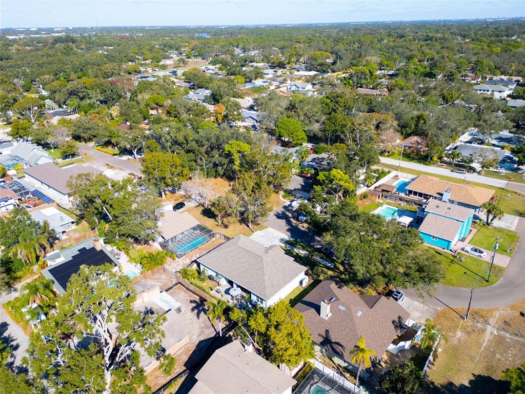 9840 West Bay Street Seminole, FL 33776 - Photo 60 of 75 an aerial view of residential houses with outdoor space
