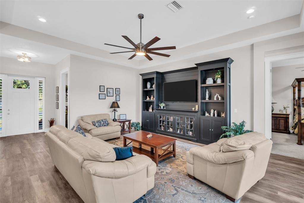 9840 West Bay Street Seminole, FL 33776 - Photo 6 of 75 a living room with furniture and a flat screen tv