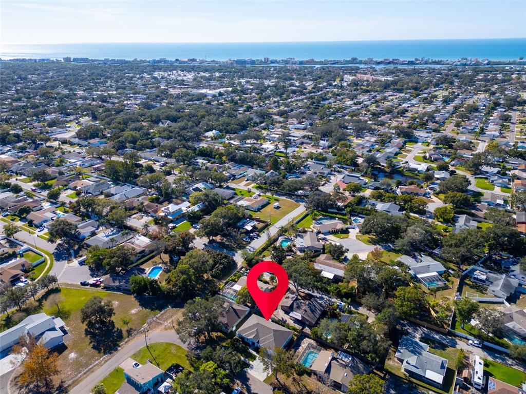 9840 West Bay Street Seminole, FL 33776 - Photo 67 of 75 an aerial view of residential houses with outdoor space and swimming pool