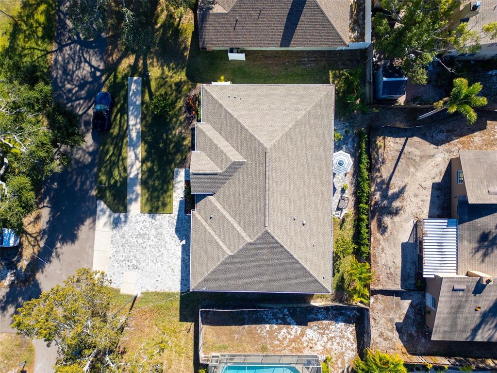 9840 West Bay Street Seminole, FL 33776 - Photo 75 of 75 an aerial view of a house with a yard and seating area