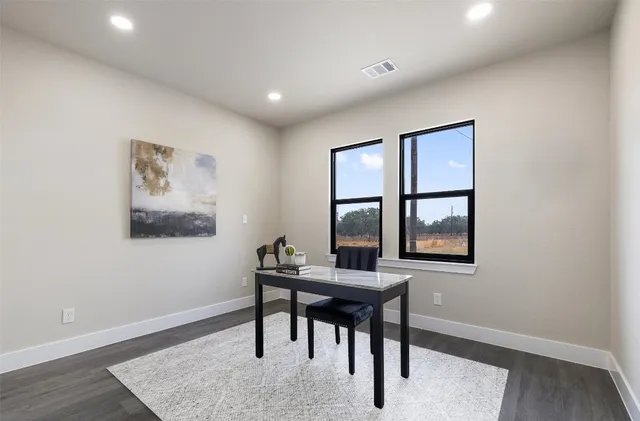 a workspace with furniture and window