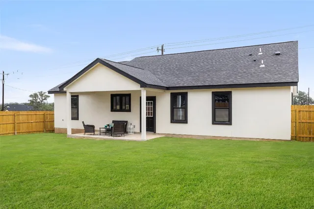 a front view of house with yard and seating area