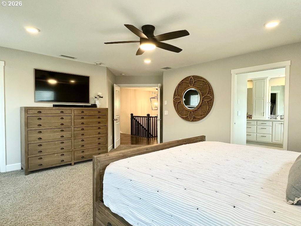 885 North Squire Drive Ridgefield, WA 98642 - Photo 11 of 29 a bedroom with a bed and a flat screen tv