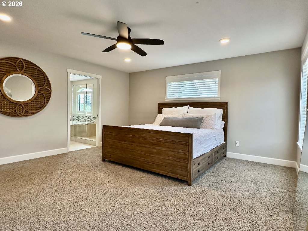 885 North Squire Drive Ridgefield, WA 98642 - Photo 12 of 29 a bedroom with a bed and window