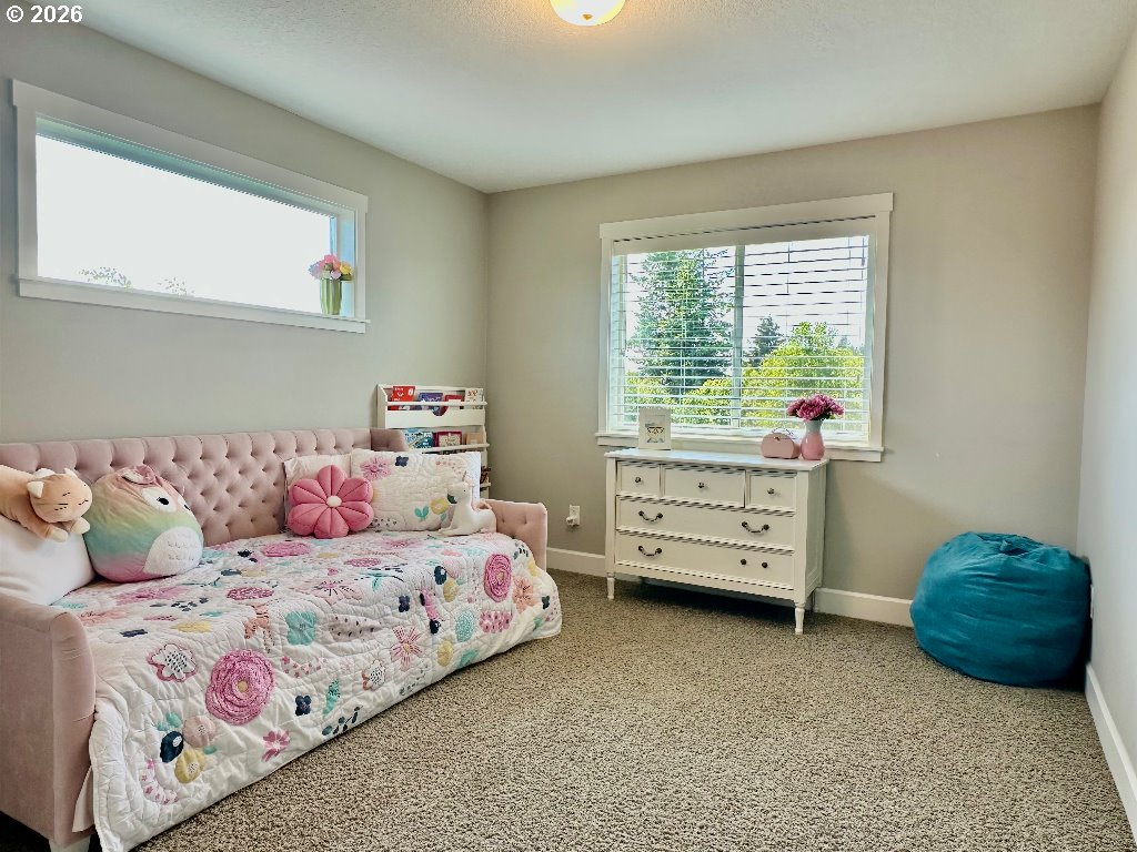 885 North Squire Drive Ridgefield, WA 98642 - Photo 19 of 29 a bedroom with a bed and a dresser