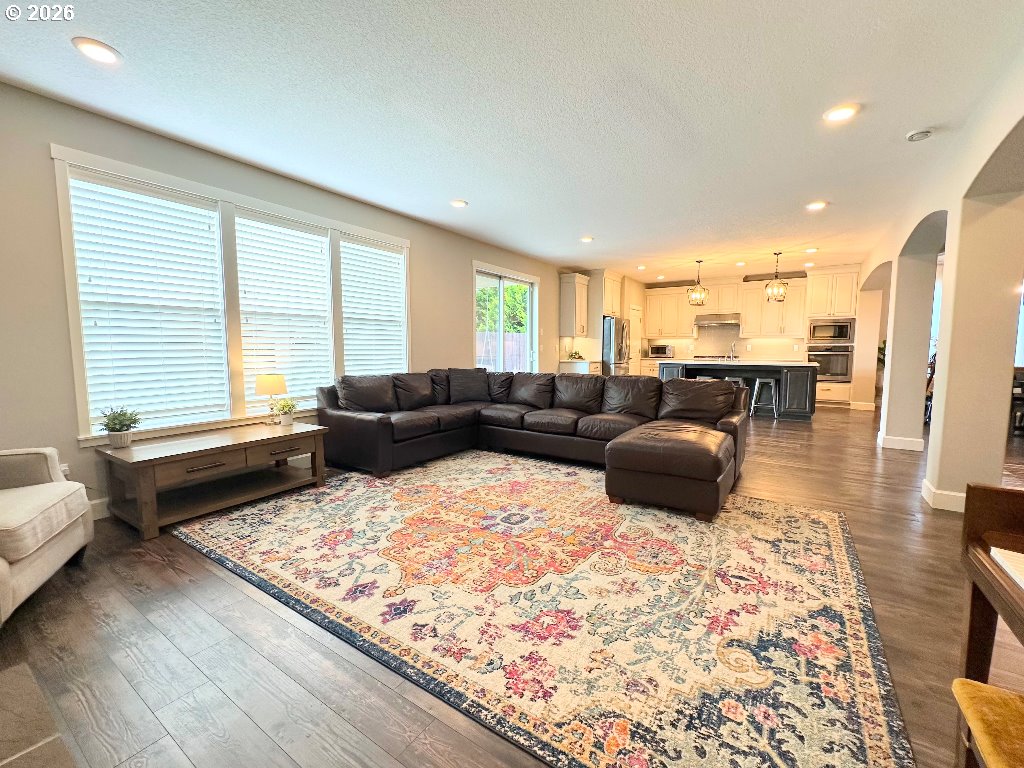 885 North Squire Drive Ridgefield, WA 98642 - Photo 6 of 29 a living room with furniture and a rug