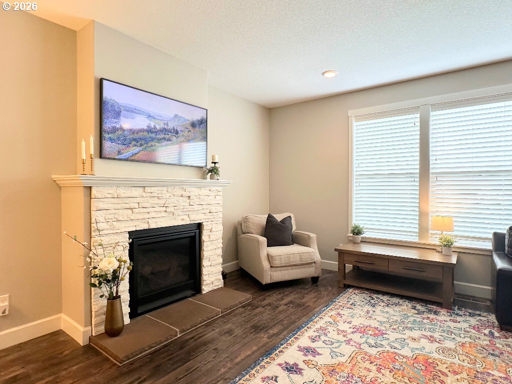 885 North Squire Drive Ridgefield, WA 98642 - Photo 7 of 29 a living room with furniture and a fireplace