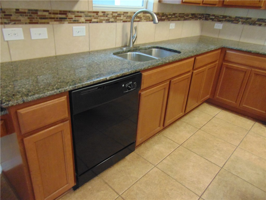 5208 Hellman Kyle, TX 78640 - Photo 12 of 26 a kitchen with a sink and cabinets