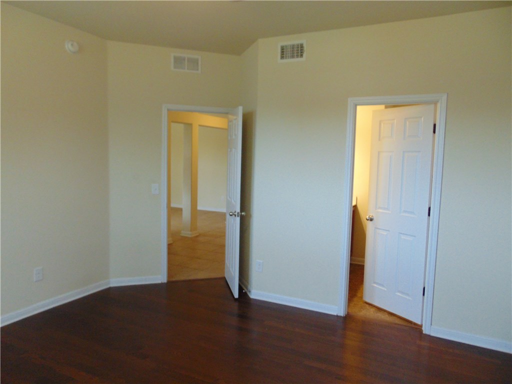 5208 Hellman Kyle, TX 78640 - Photo 15 of 26 a view of empty room with wooden floor