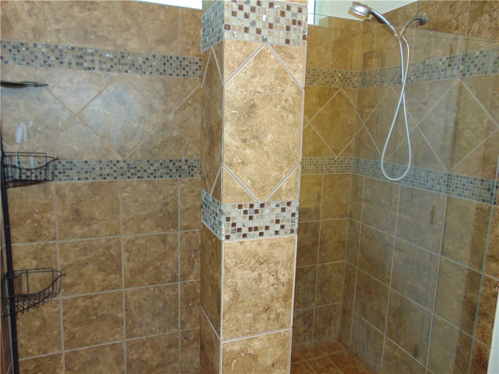 5208 Hellman Kyle, TX 78640 - Photo 17 of 26 a bathroom with a shower