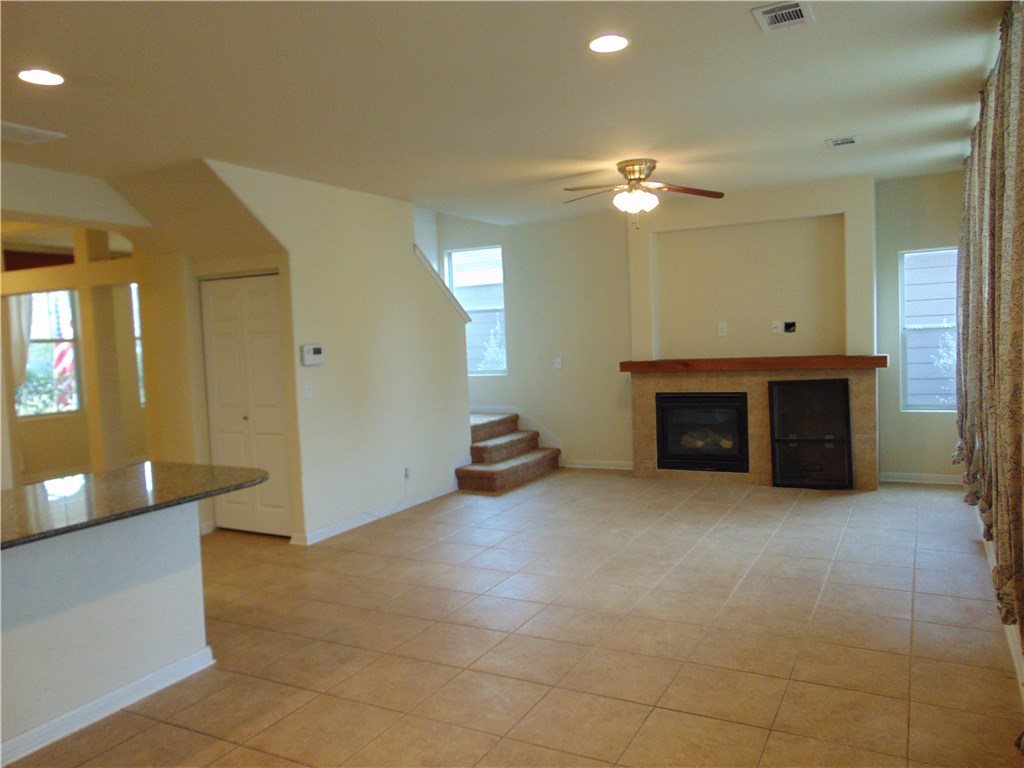 5208 Hellman Kyle, TX 78640 - Photo 3 of 26 a view of an empty room with a fireplace