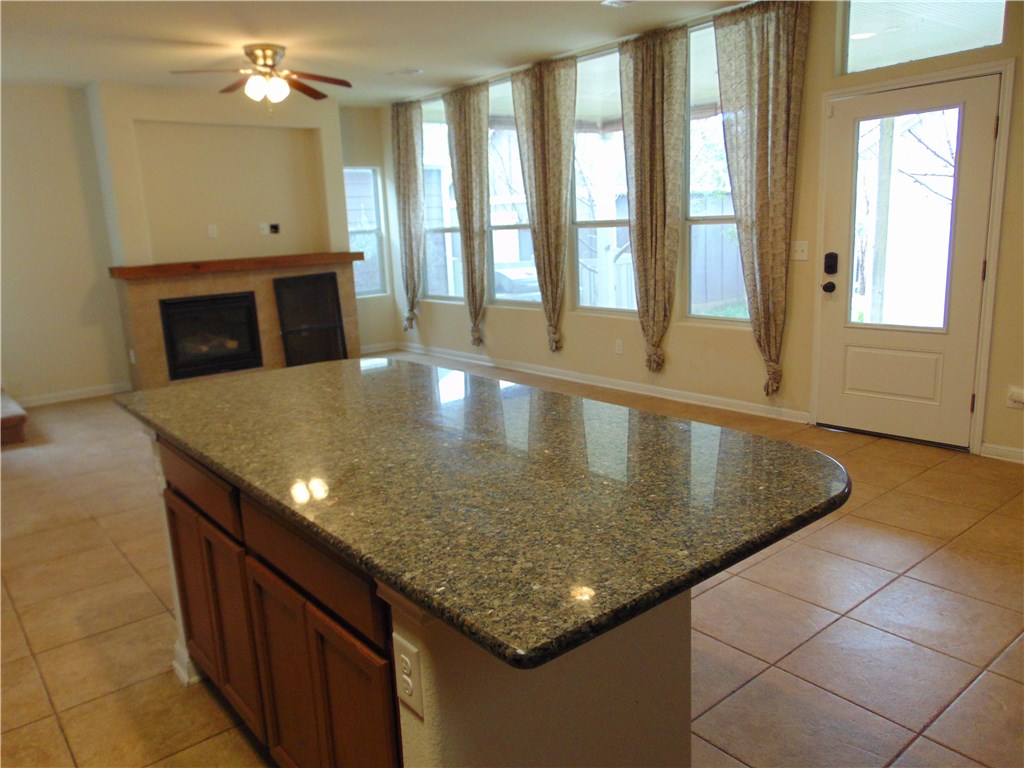 5208 Hellman Kyle, TX 78640 - Photo 7 of 26 a bathroom with a granite countertop sink and a large mirror
