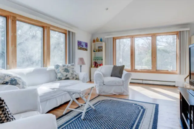 a living room with furniture and a large window