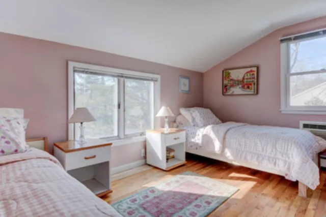 a view of a house with snow on the side of the road
