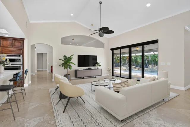 a spacious bedroom with a bed and a dresser