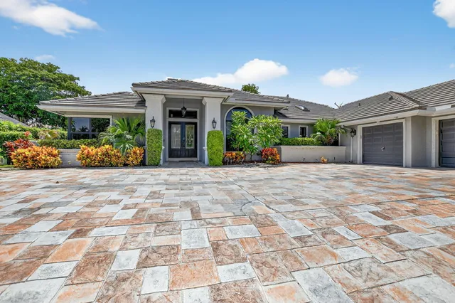 a front view of a building with garden