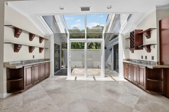 a bedroom with a bed and a chandelier fan