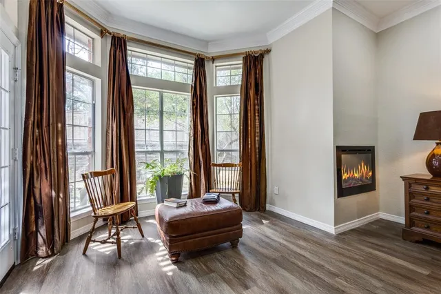 a living room with a bed furniture and a window